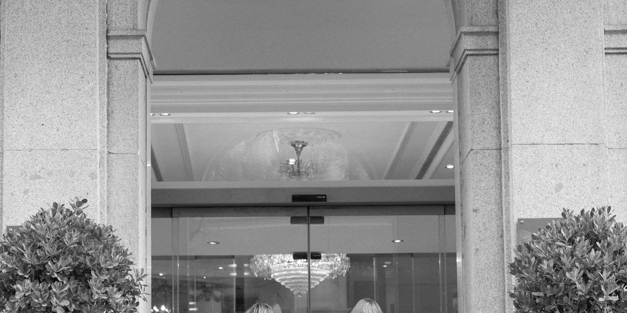 women walking into a store