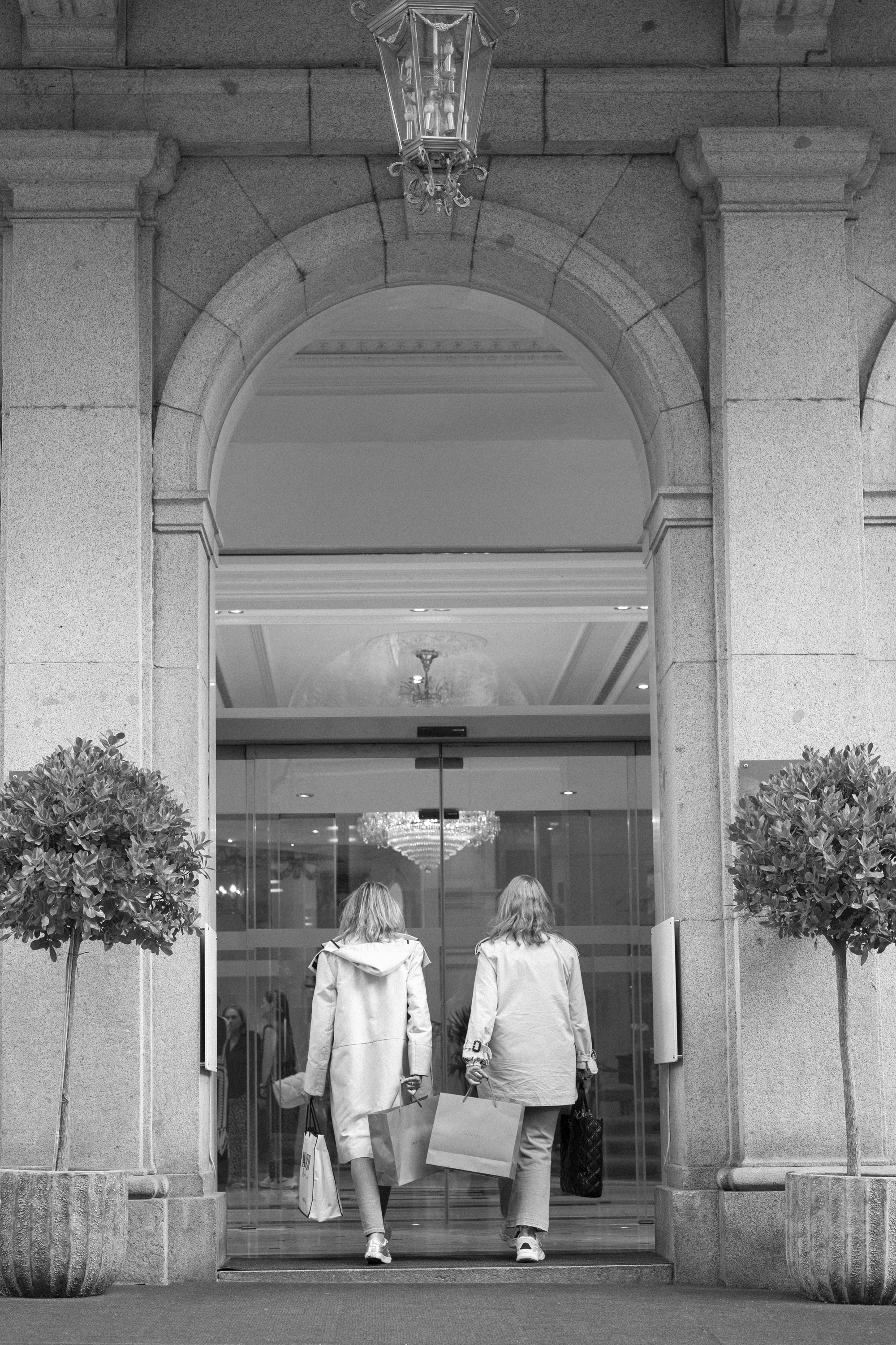 women walking into a store