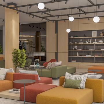 a room with a large couch and tables