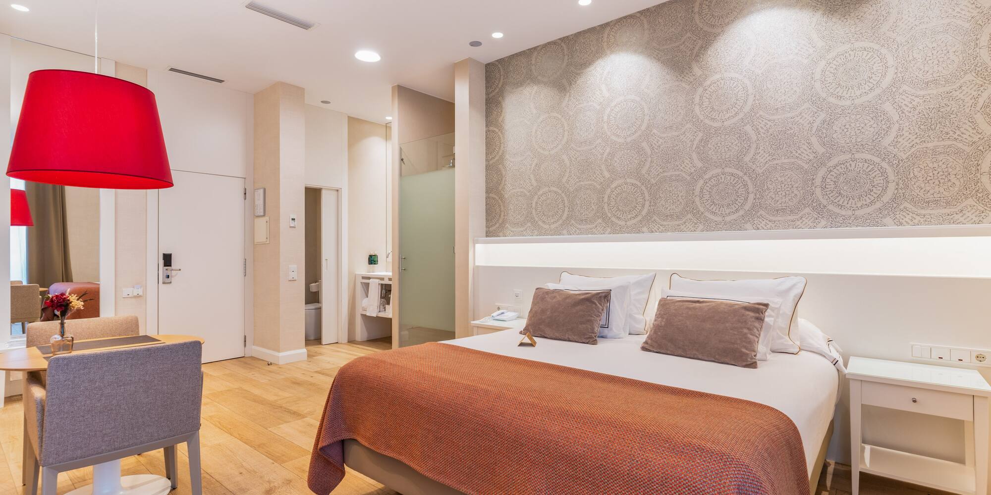 a bedroom with a bed and a chair