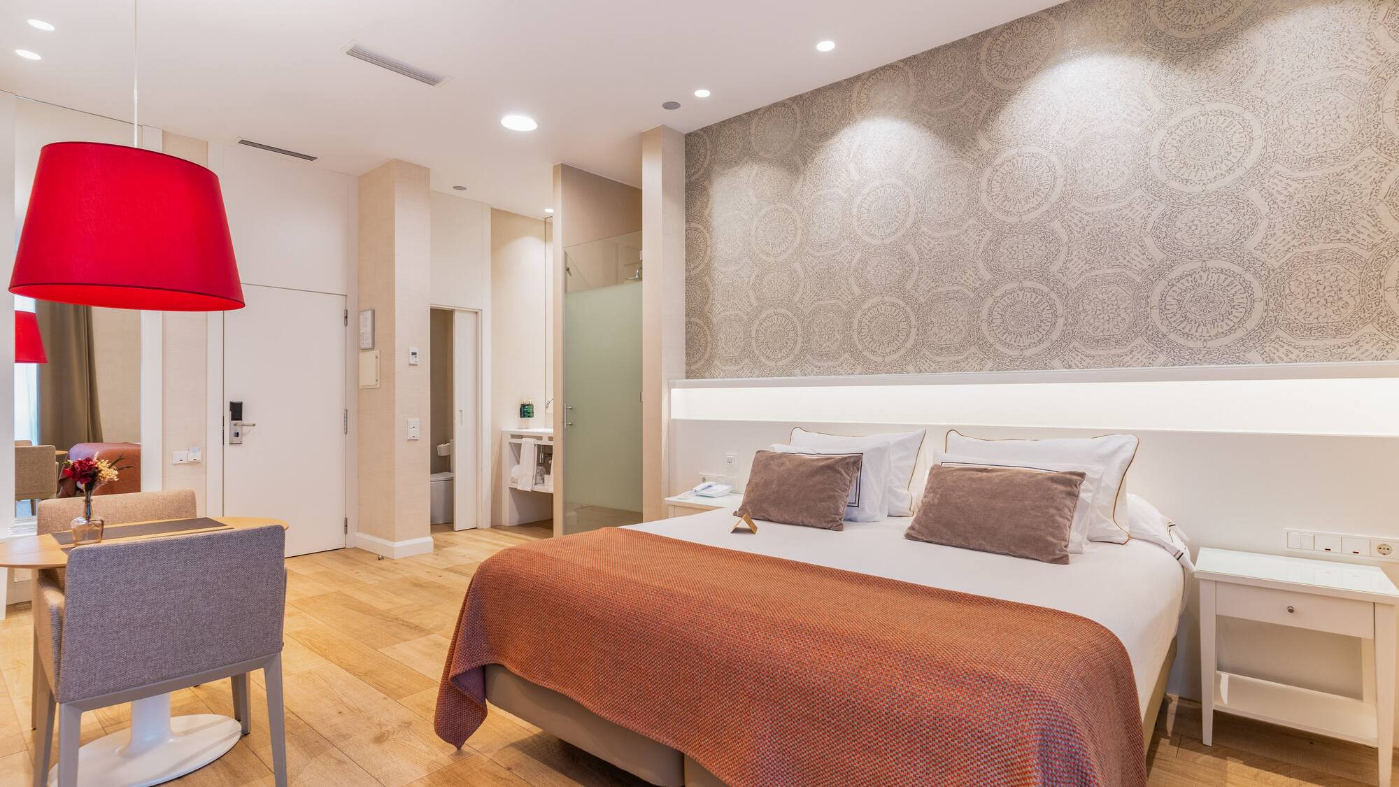 a bedroom with a bed and a chair