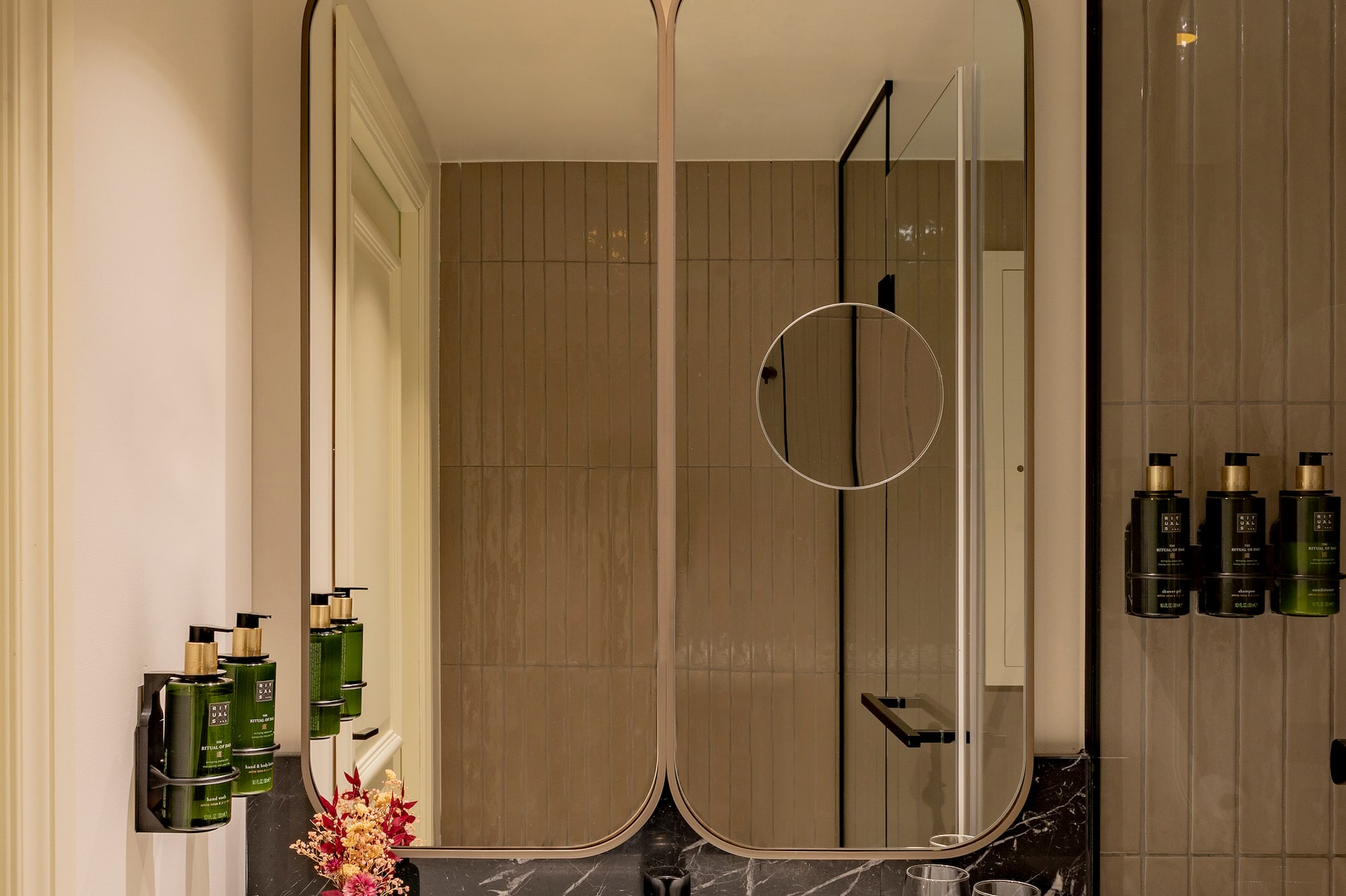 a bathroom with a mirror and sink