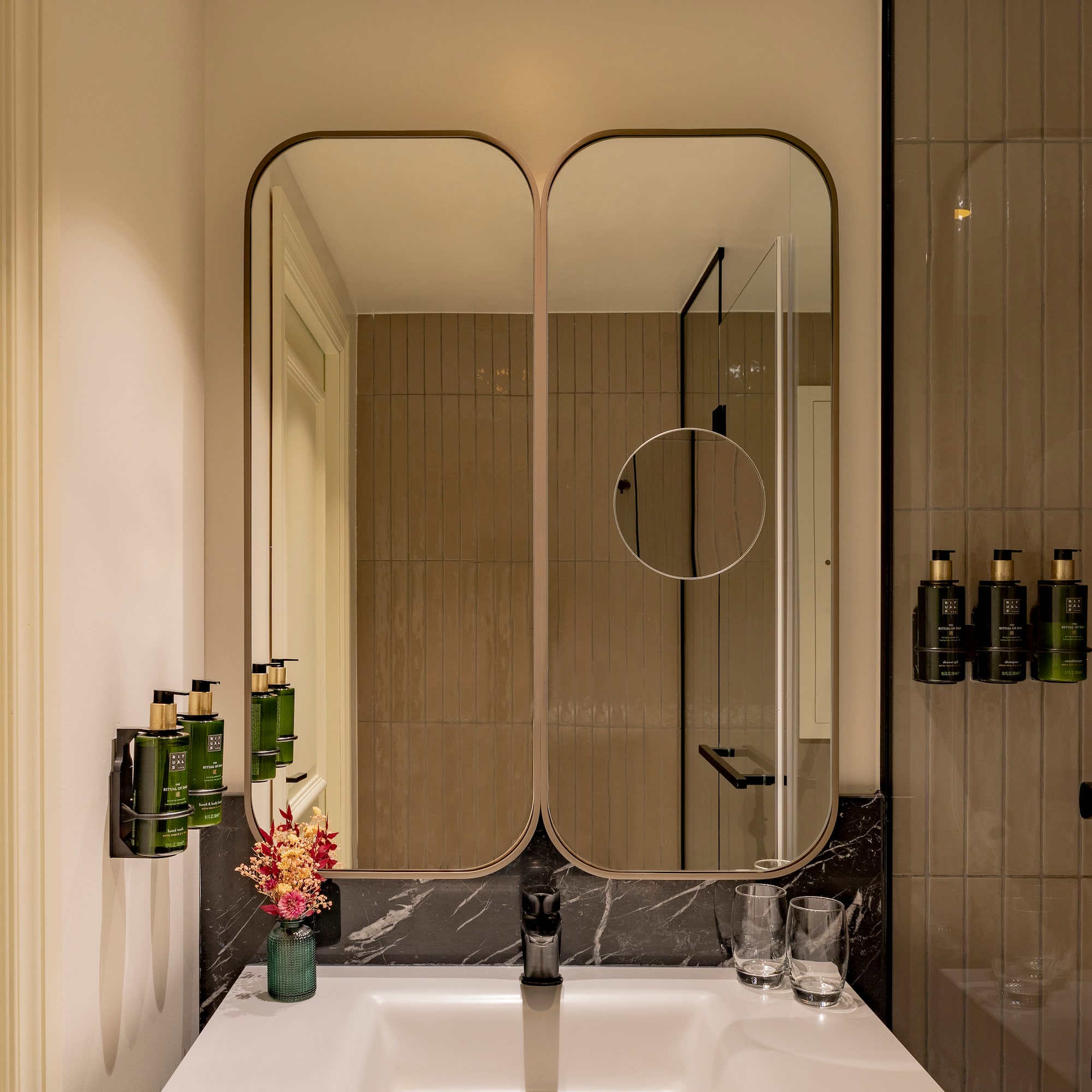 a bathroom with a mirror and sink