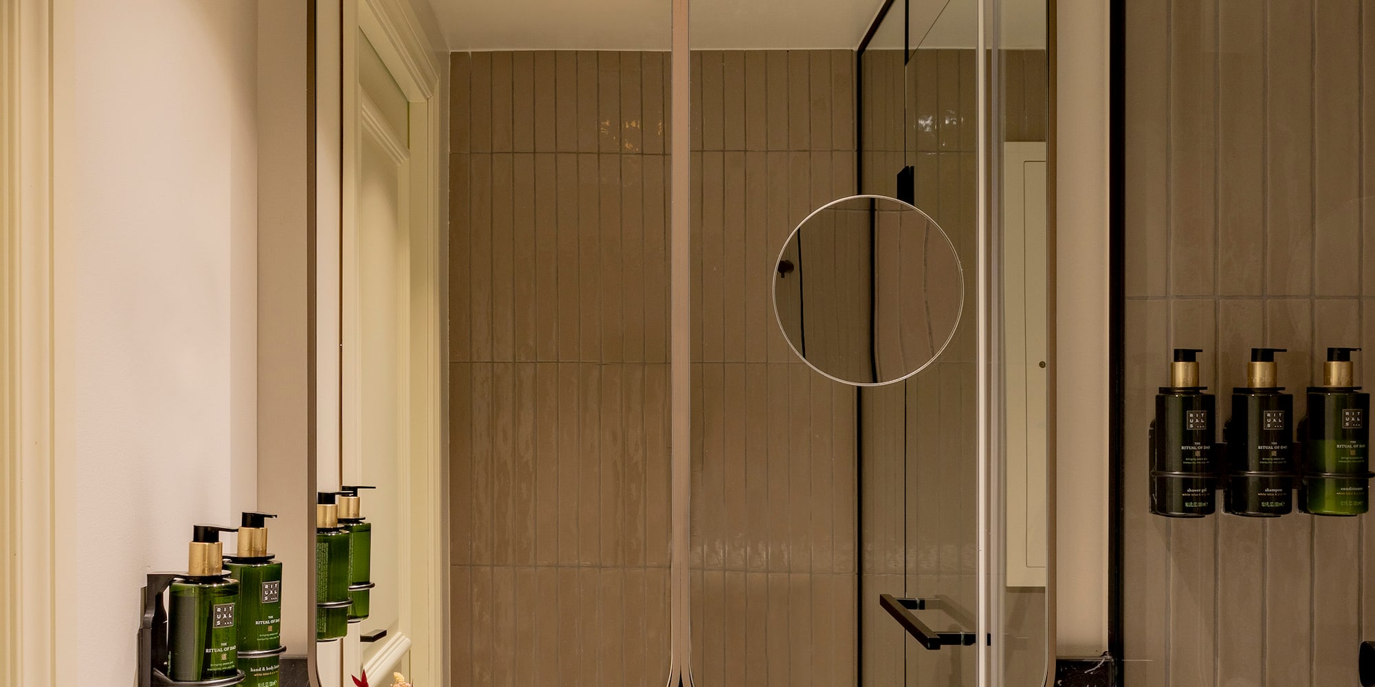 a bathroom with a mirror and sink