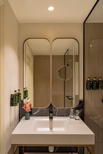 a bathroom with a mirror and sink