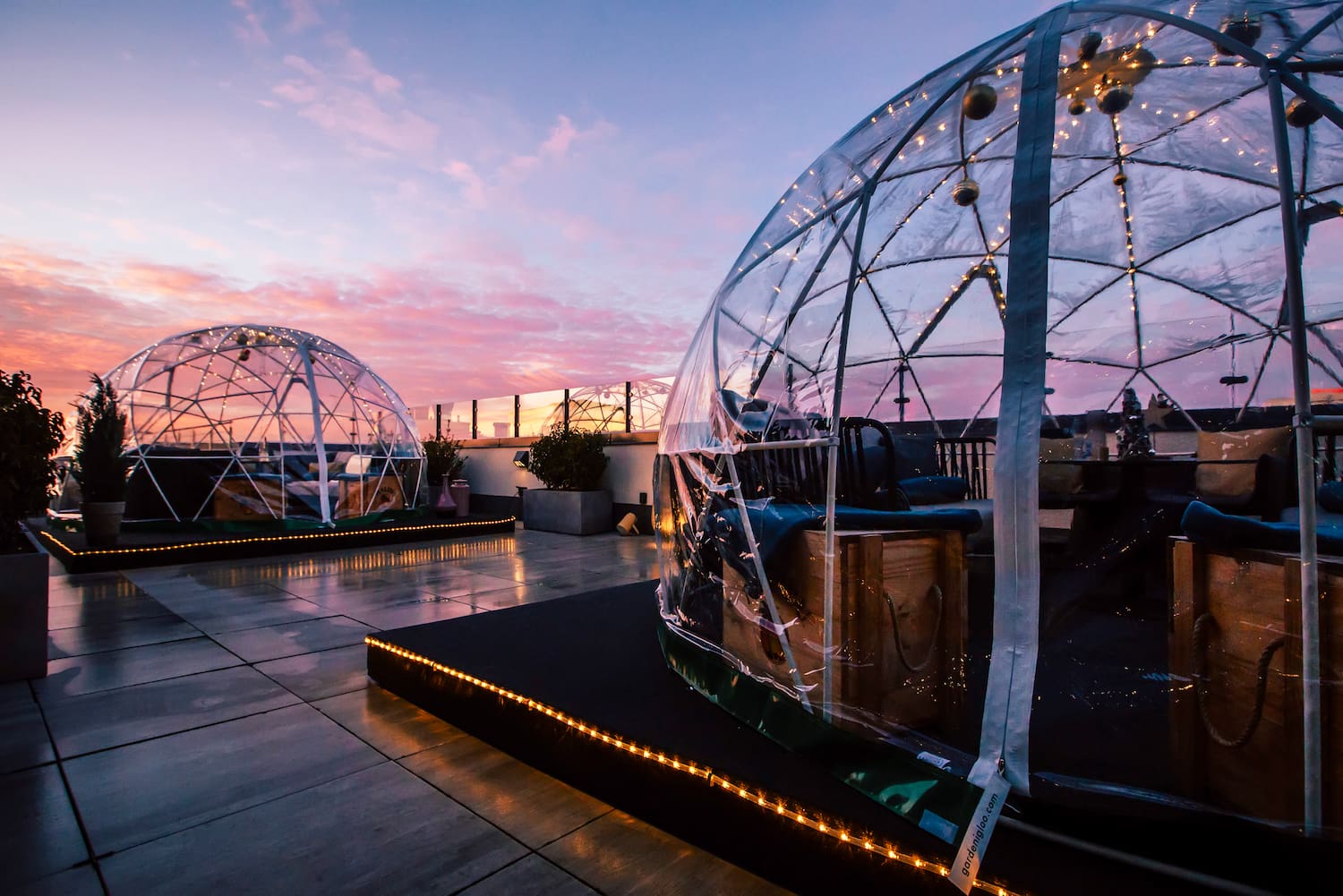a clear dome with lights on top of it