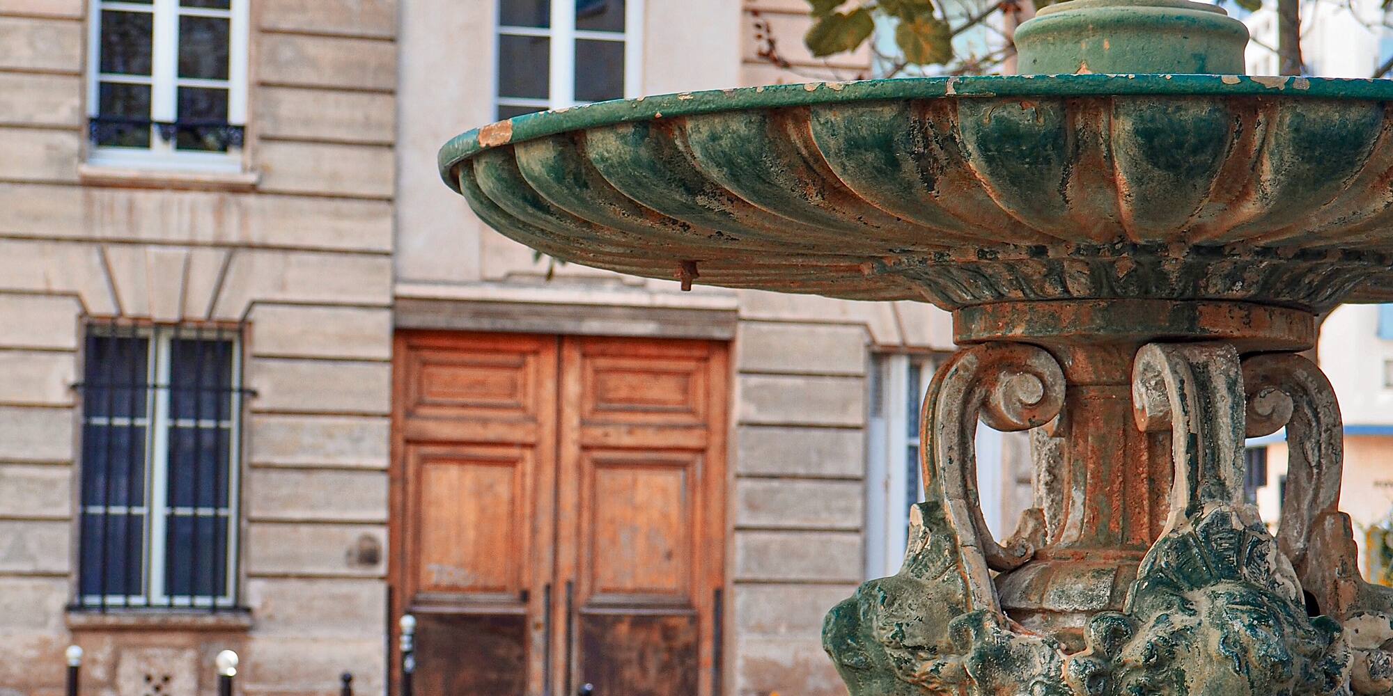 a fountain in front of a building