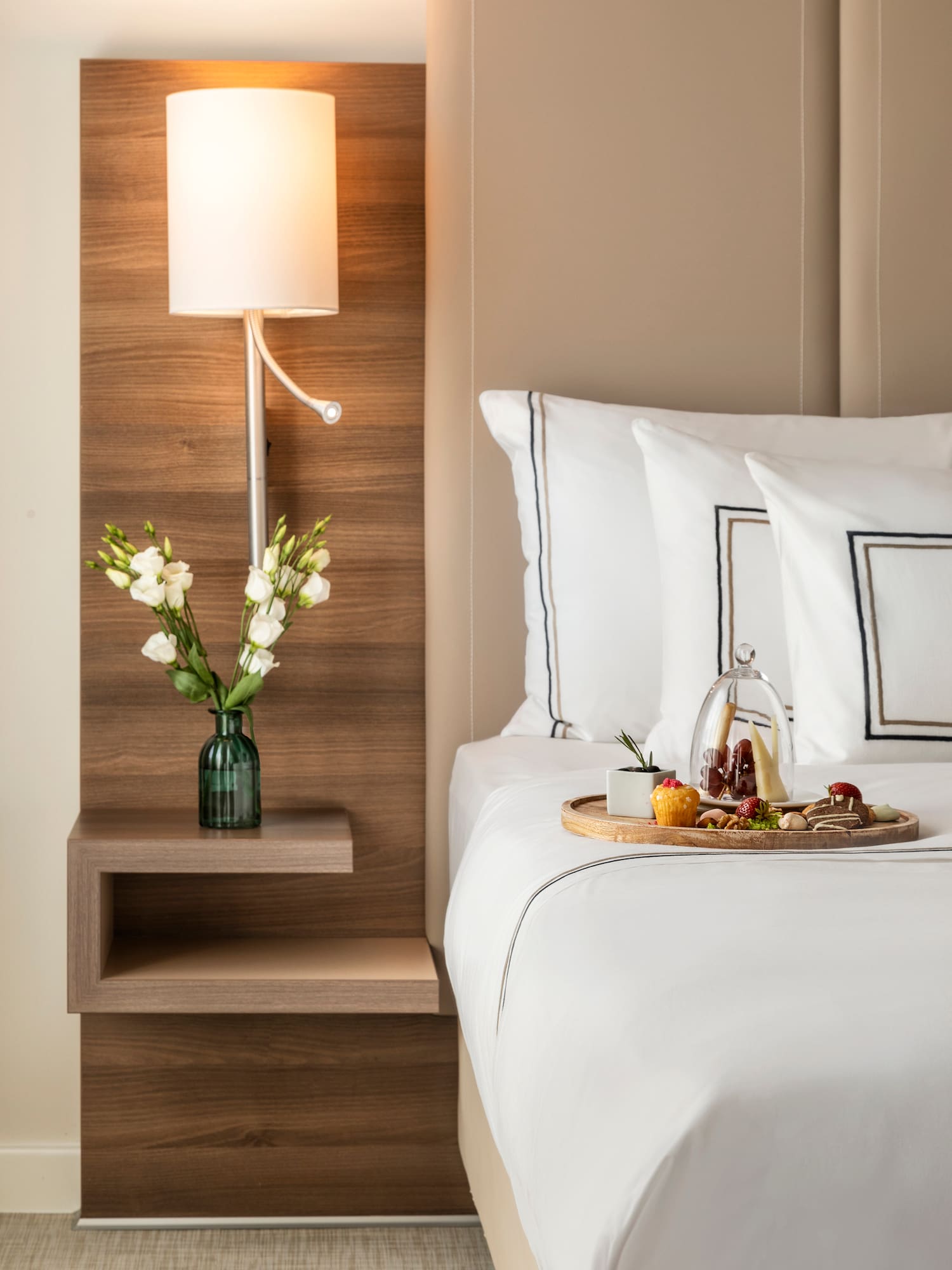 a tray of food on a bed