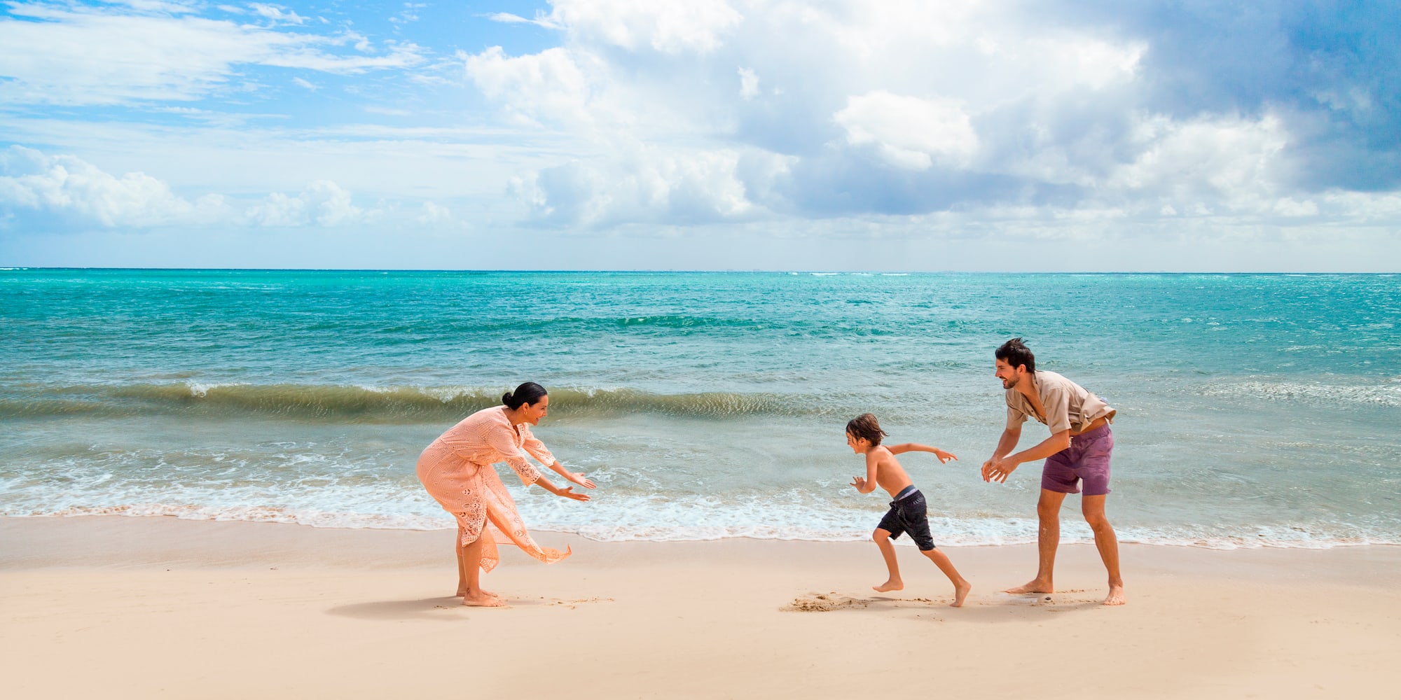 a group of people playing on a beach