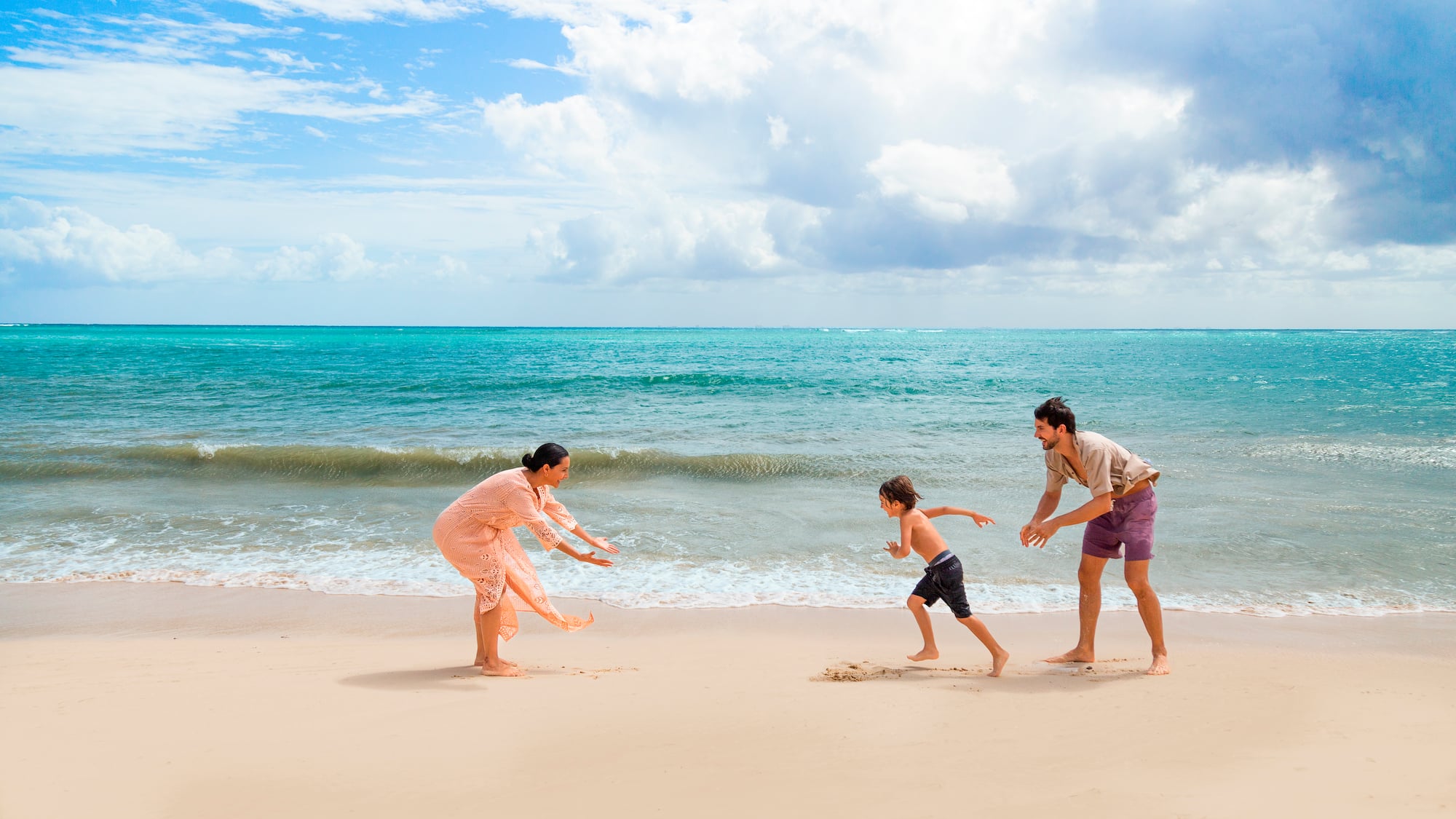 a group of people playing on a beach