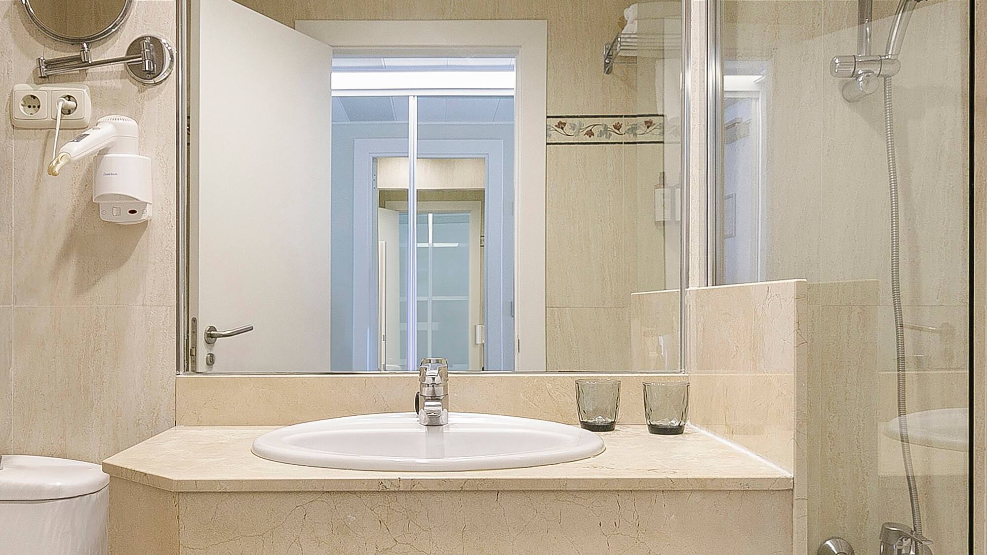 a bathroom with a sink and shower