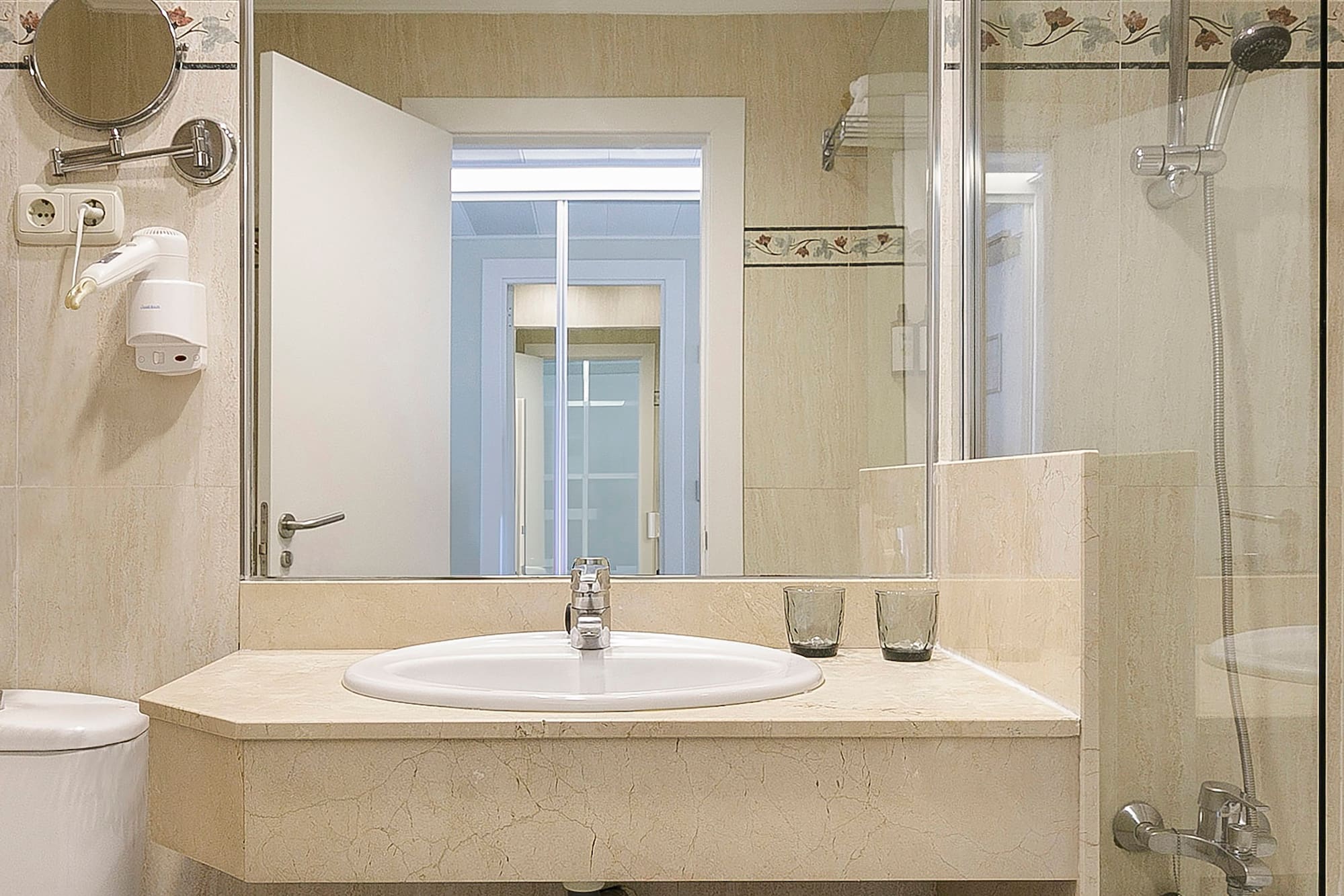 a bathroom with a sink and shower