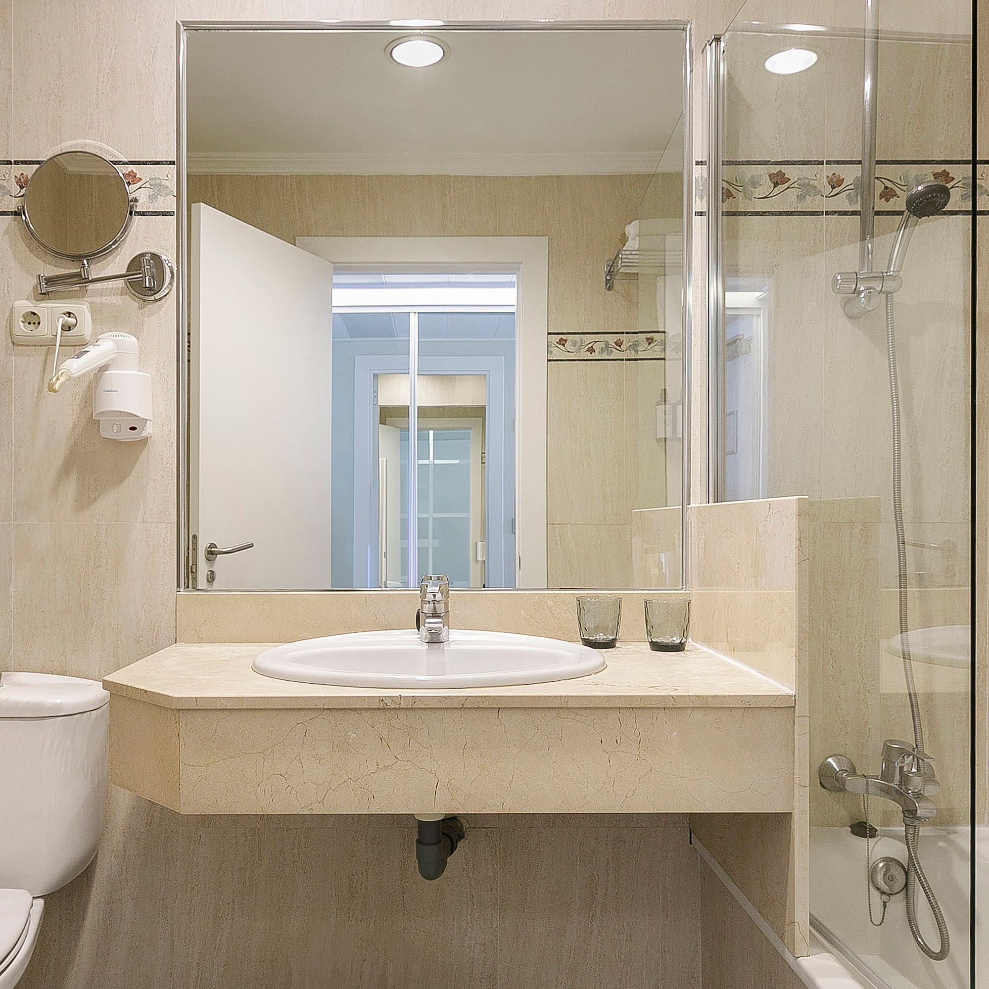 a bathroom with a sink and shower