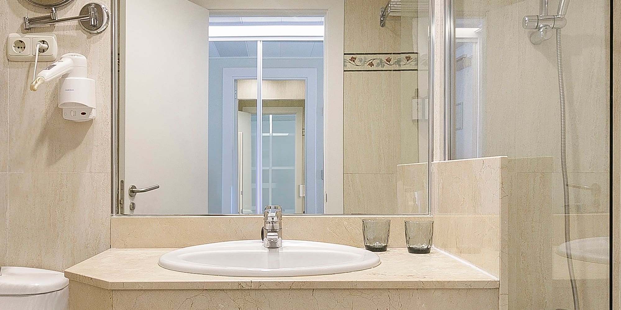 a bathroom with a sink and shower