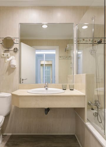 a bathroom with a sink and shower