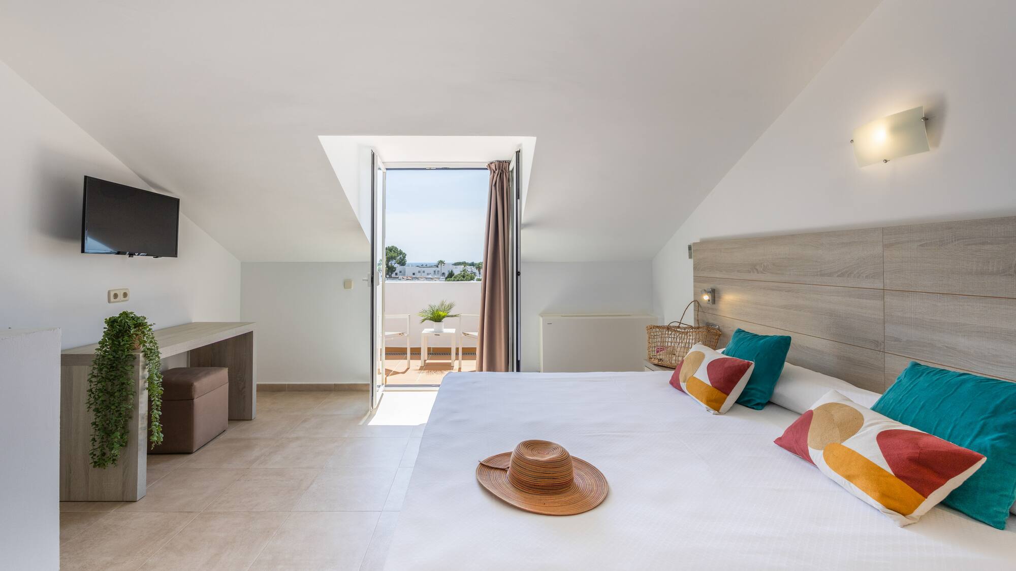 a bedroom with a bed and a hat