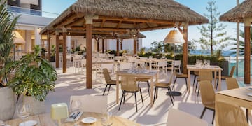 a restaurant with tables and chairs