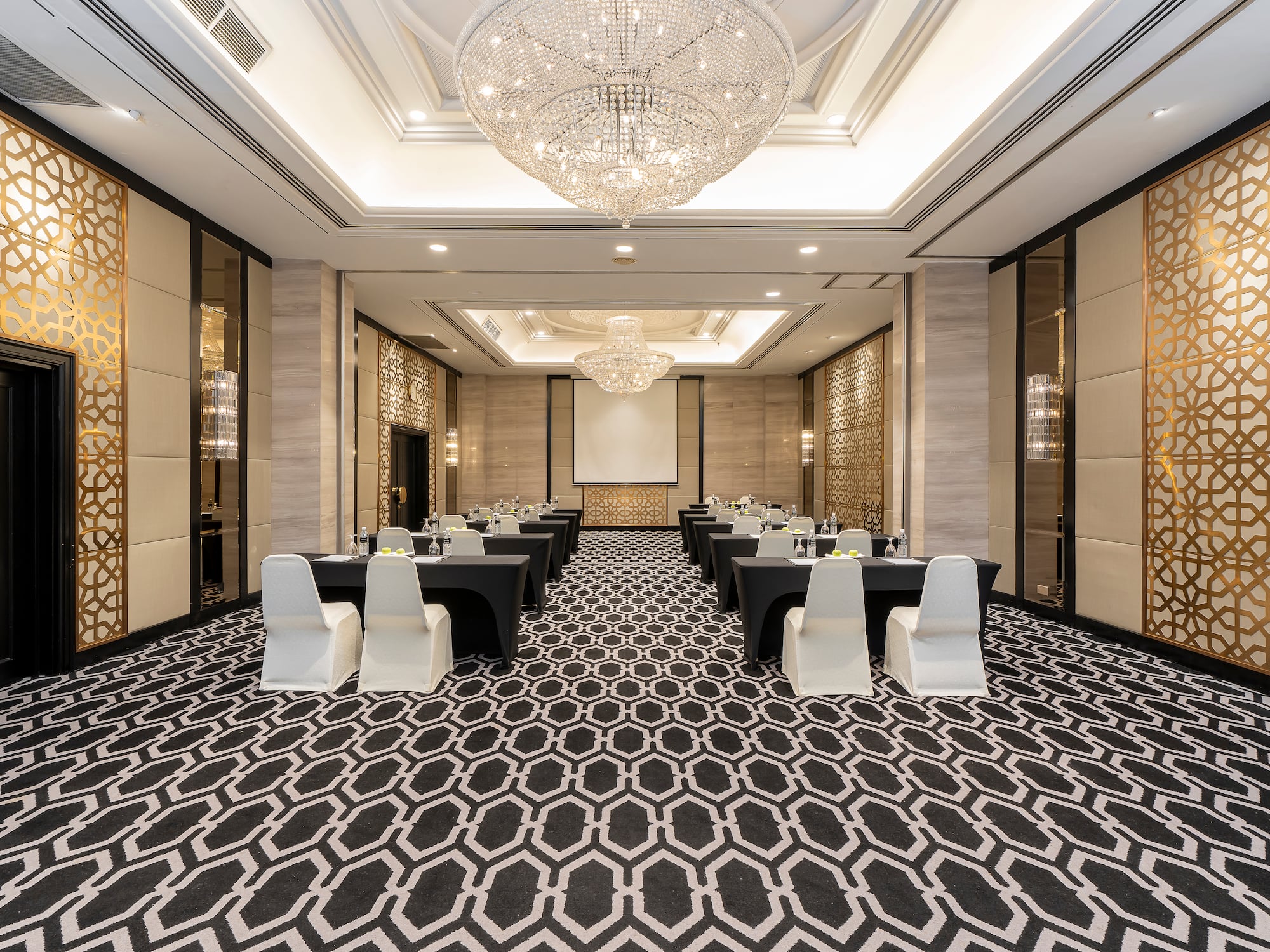 a room with black tables and chairs