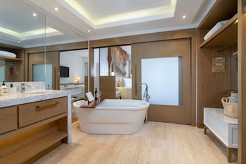a bathroom with a tub and a sink
