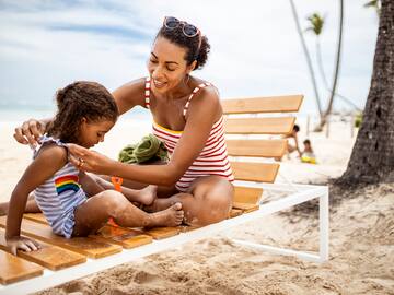 a woman and a child on a beach chair