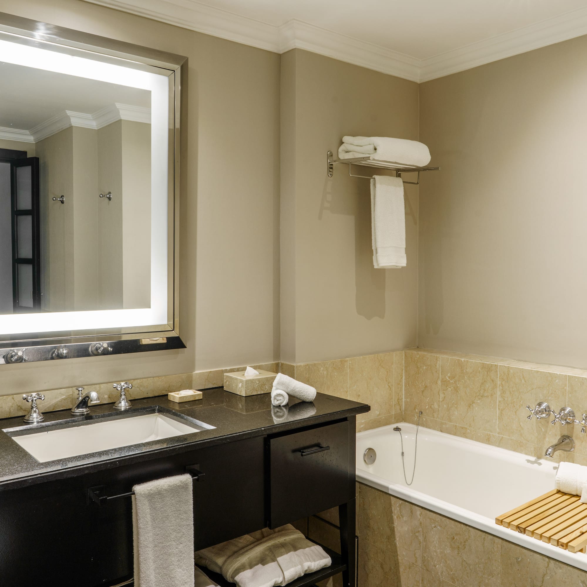 a bathroom with a bathtub and a mirror