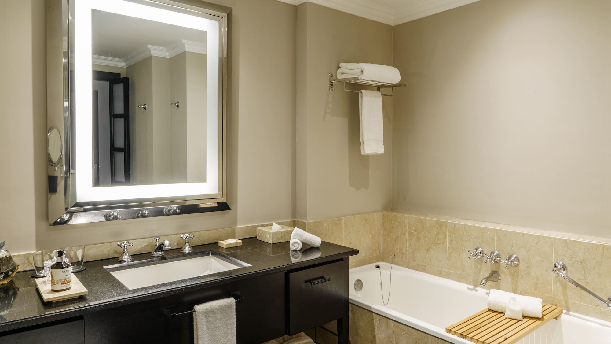 a bathroom with a bathtub and a mirror