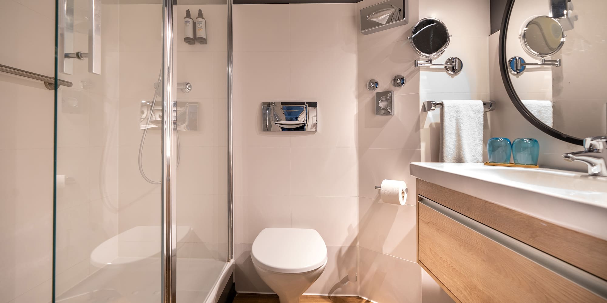 a bathroom with a shower and toilet