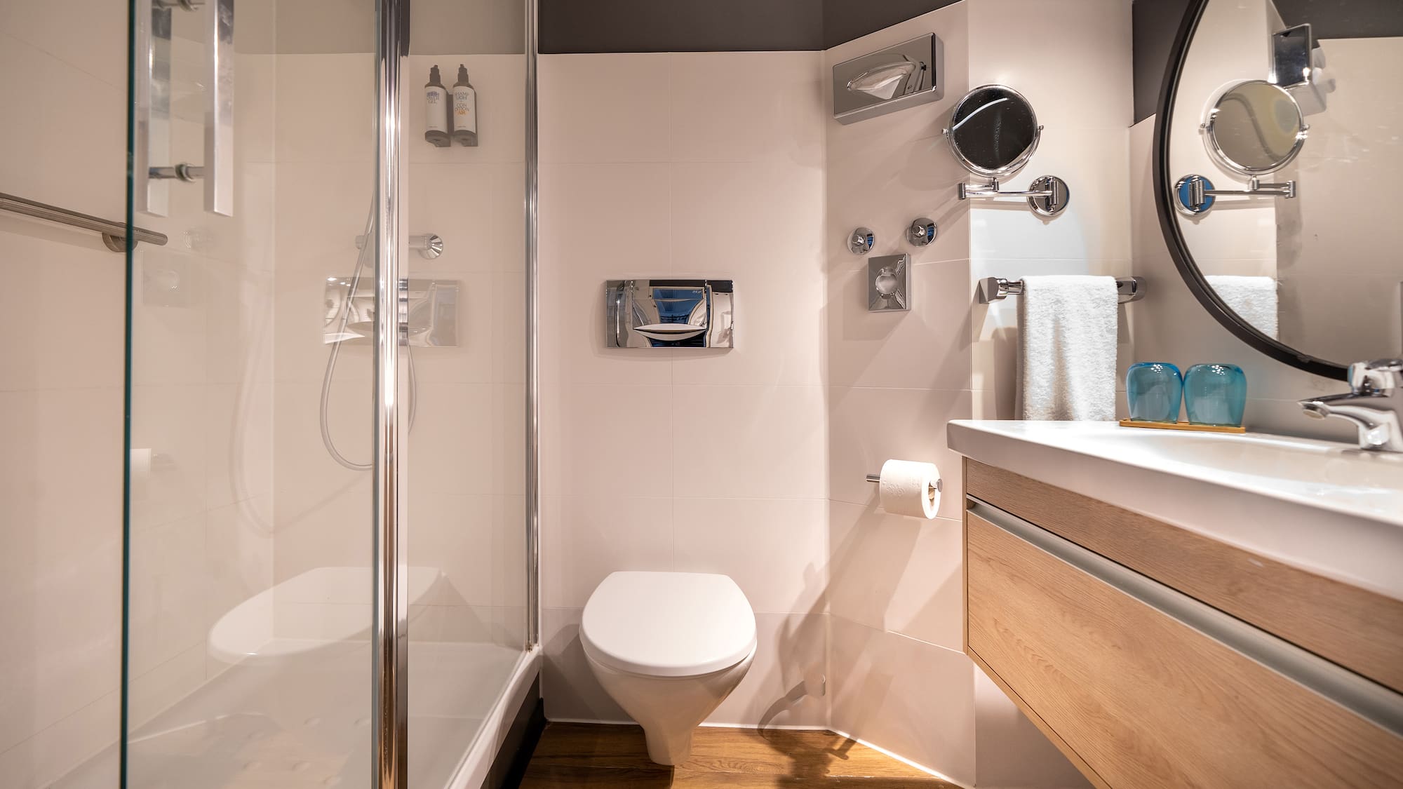 a bathroom with a shower and toilet