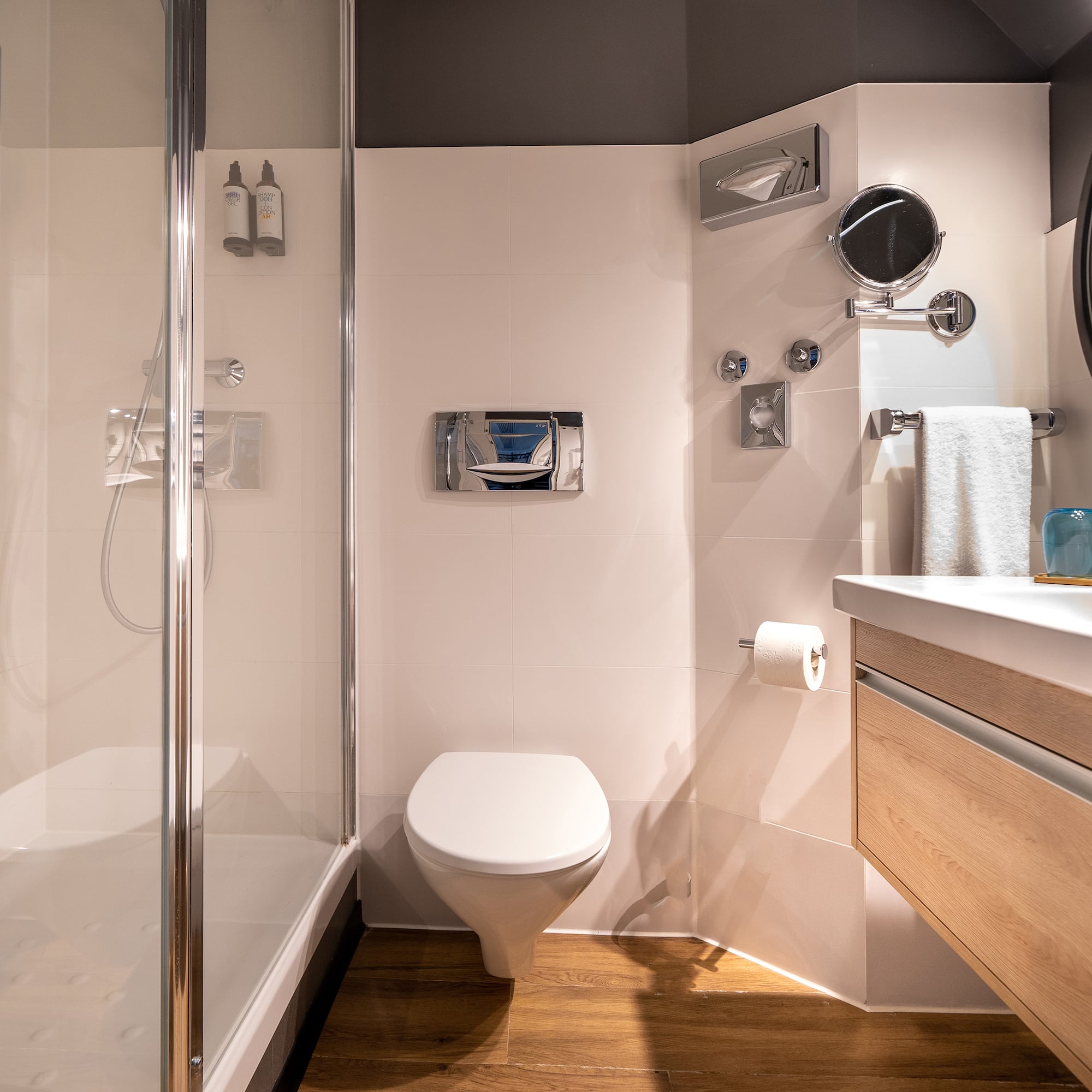 a bathroom with a shower and toilet