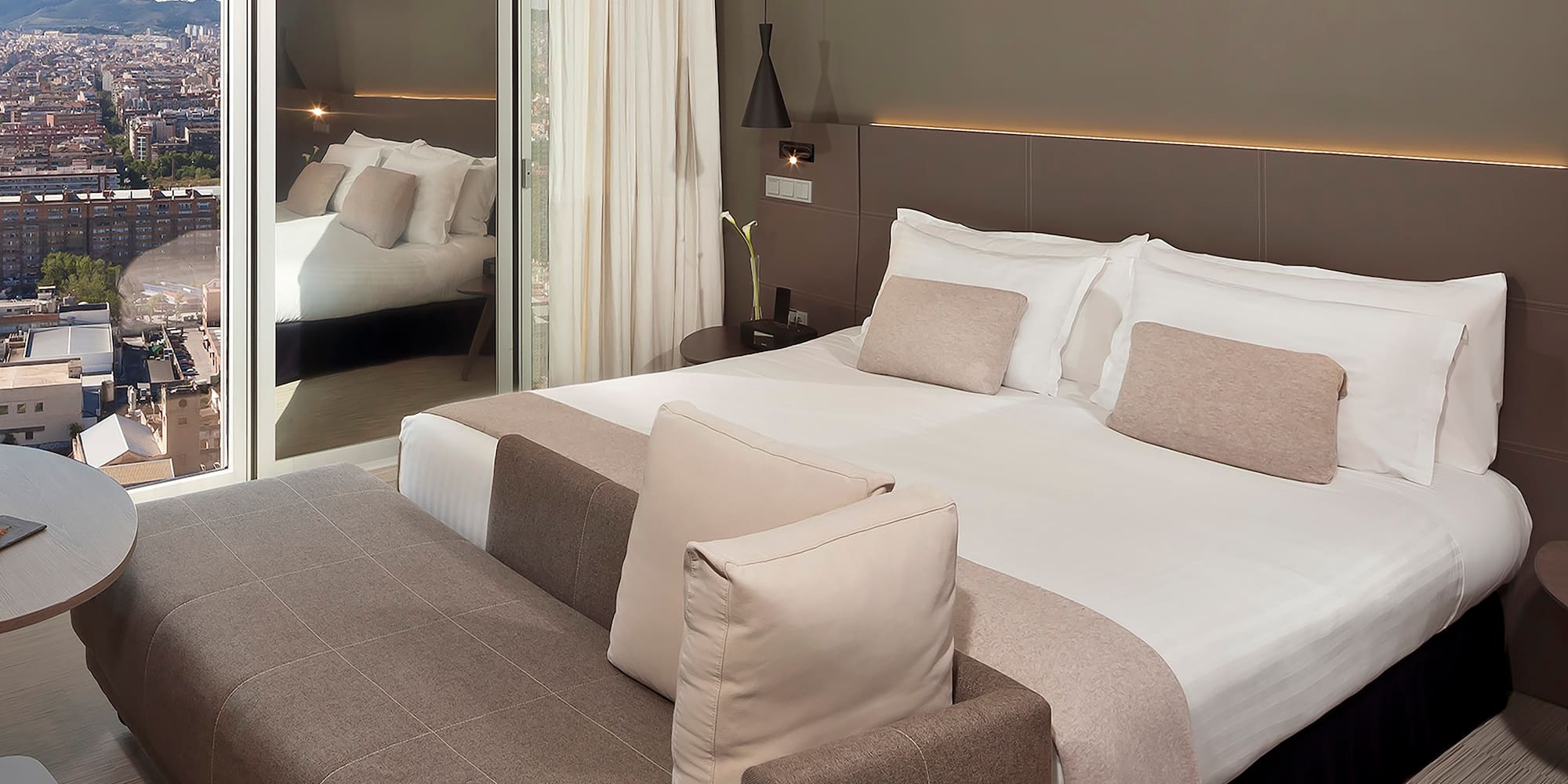 a bed with a mirror in the background