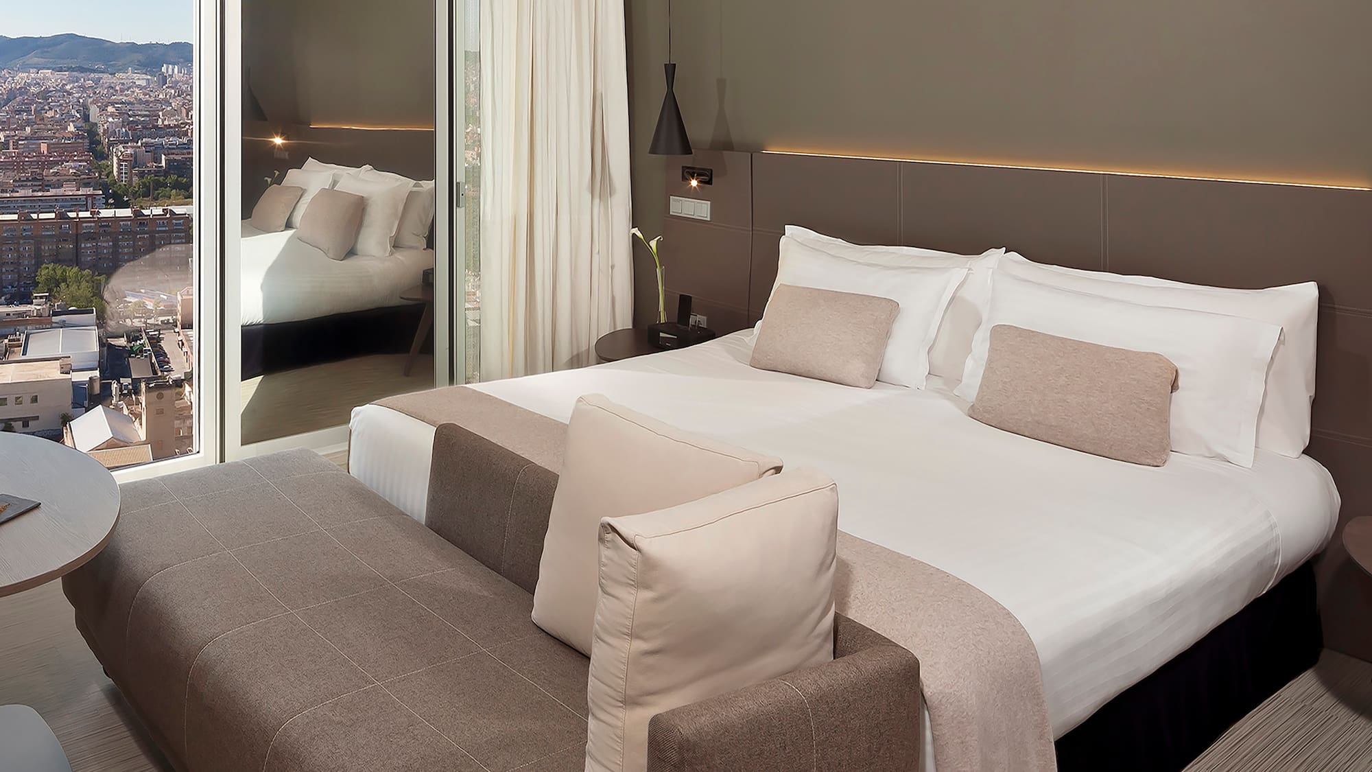 a bed with a mirror in the background