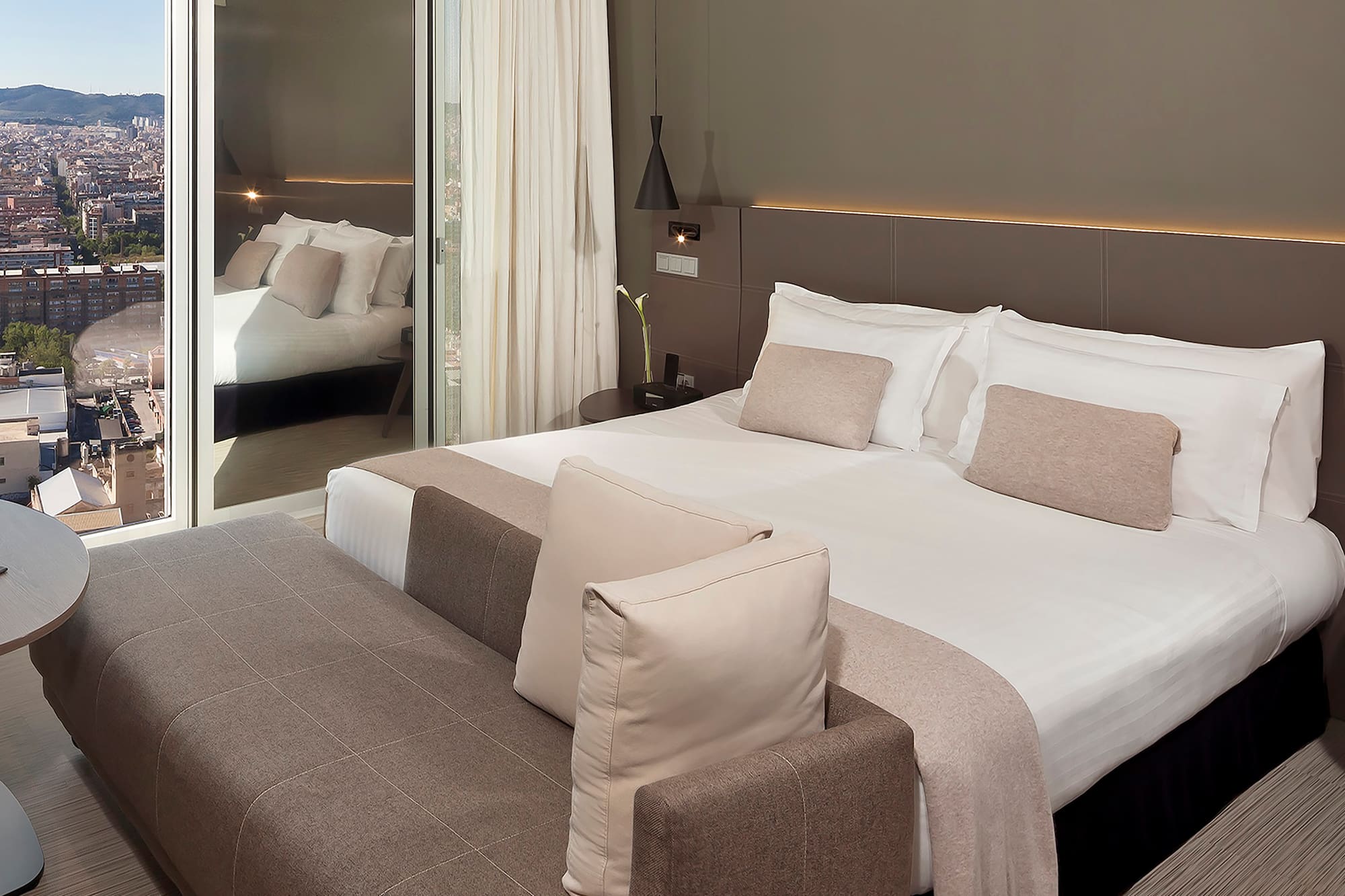 a bed with a mirror in the background