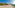 a beach with umbrellas and chairs