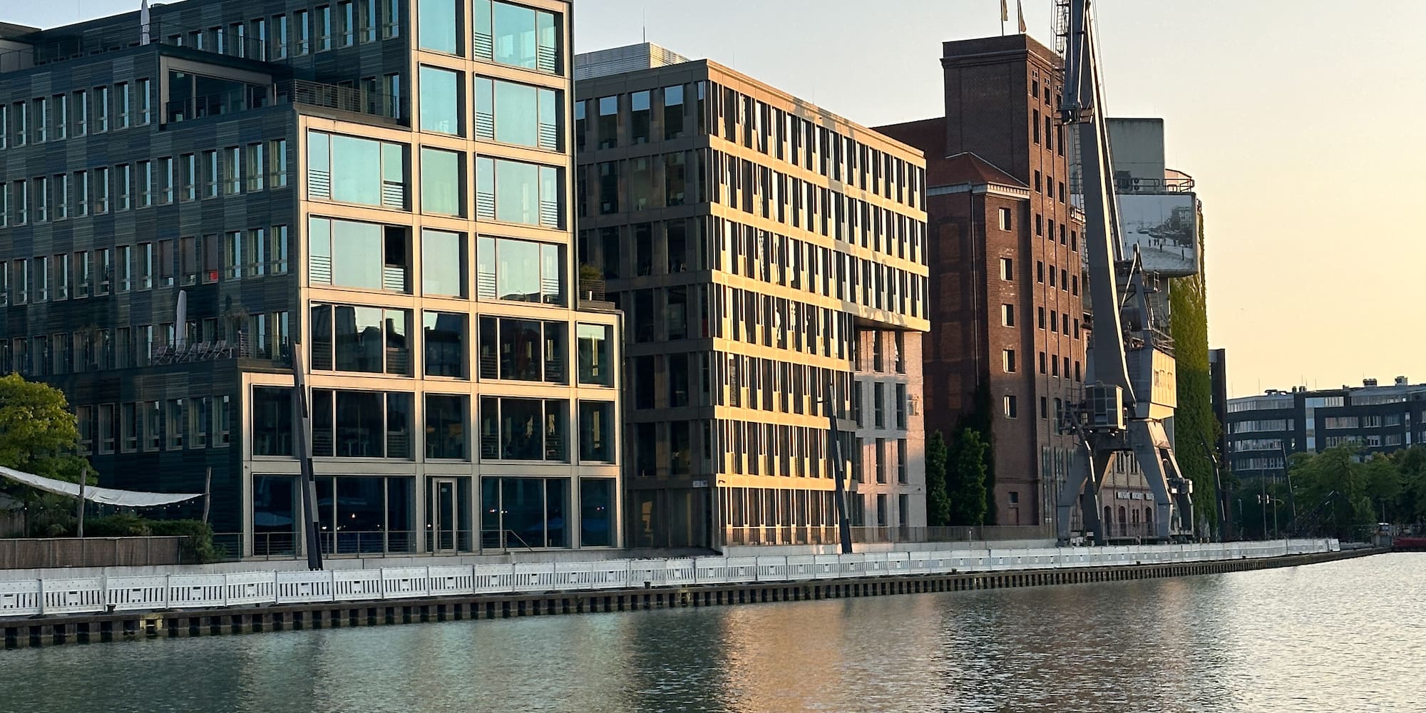 a body of water with buildings in the background