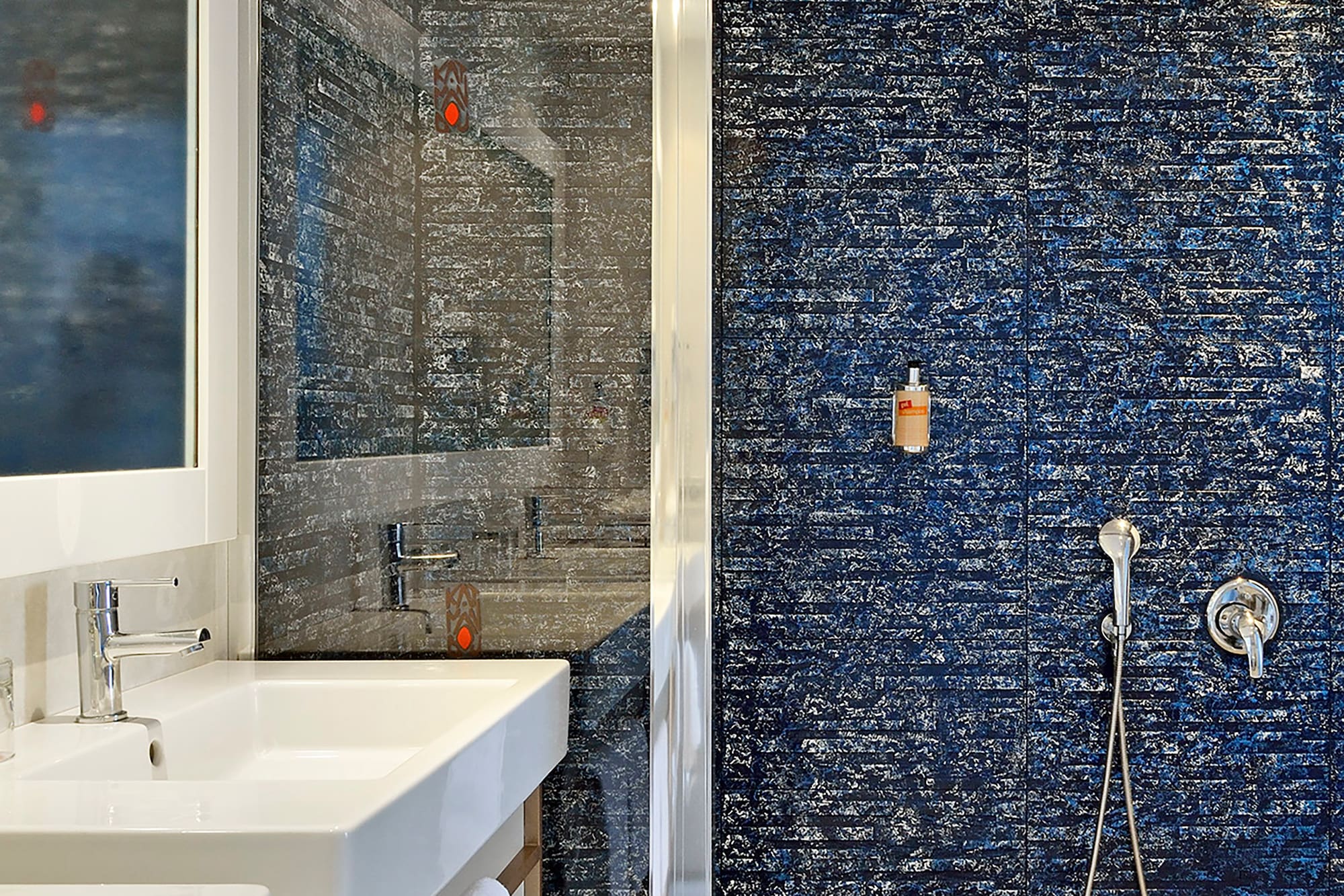 a bathroom with a shower and sink