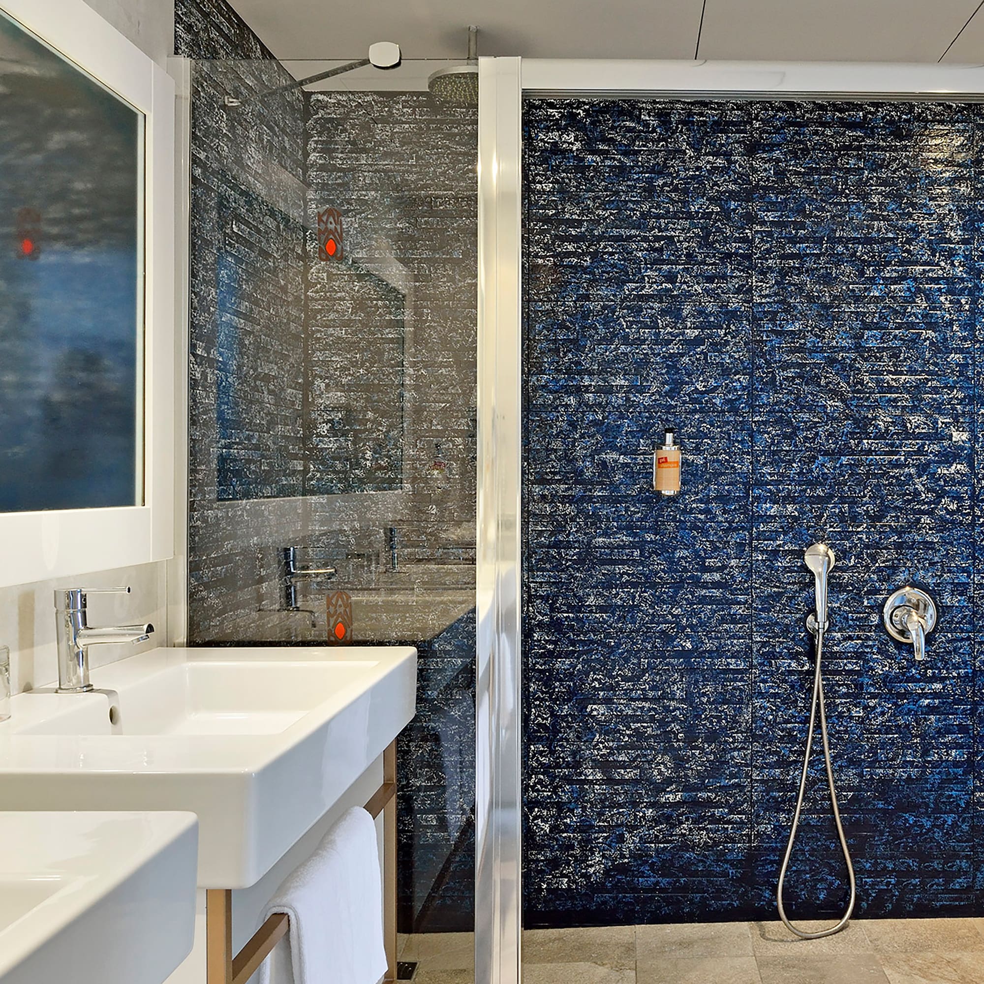 a bathroom with a shower and sink