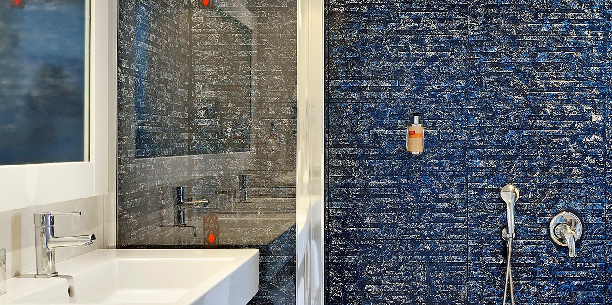 a bathroom with a shower and sink