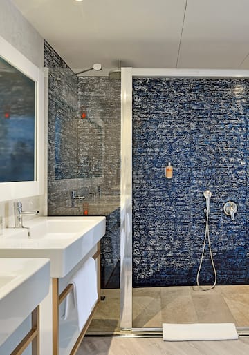 a bathroom with a shower and sink