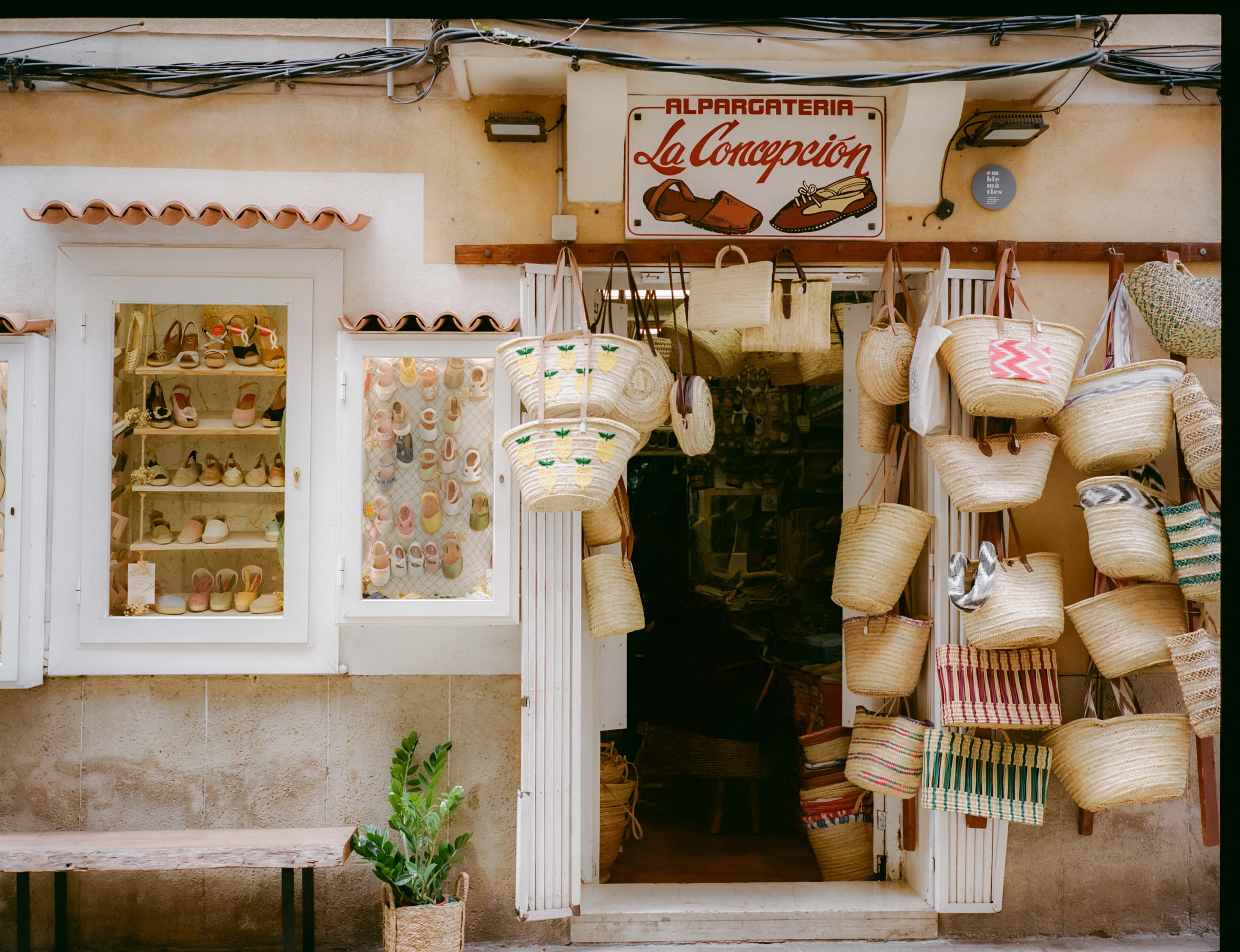 La Concepcion alpargateria facade, displaying espadrilles and woven straw bags.