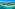 a beach with buildings and a body of water