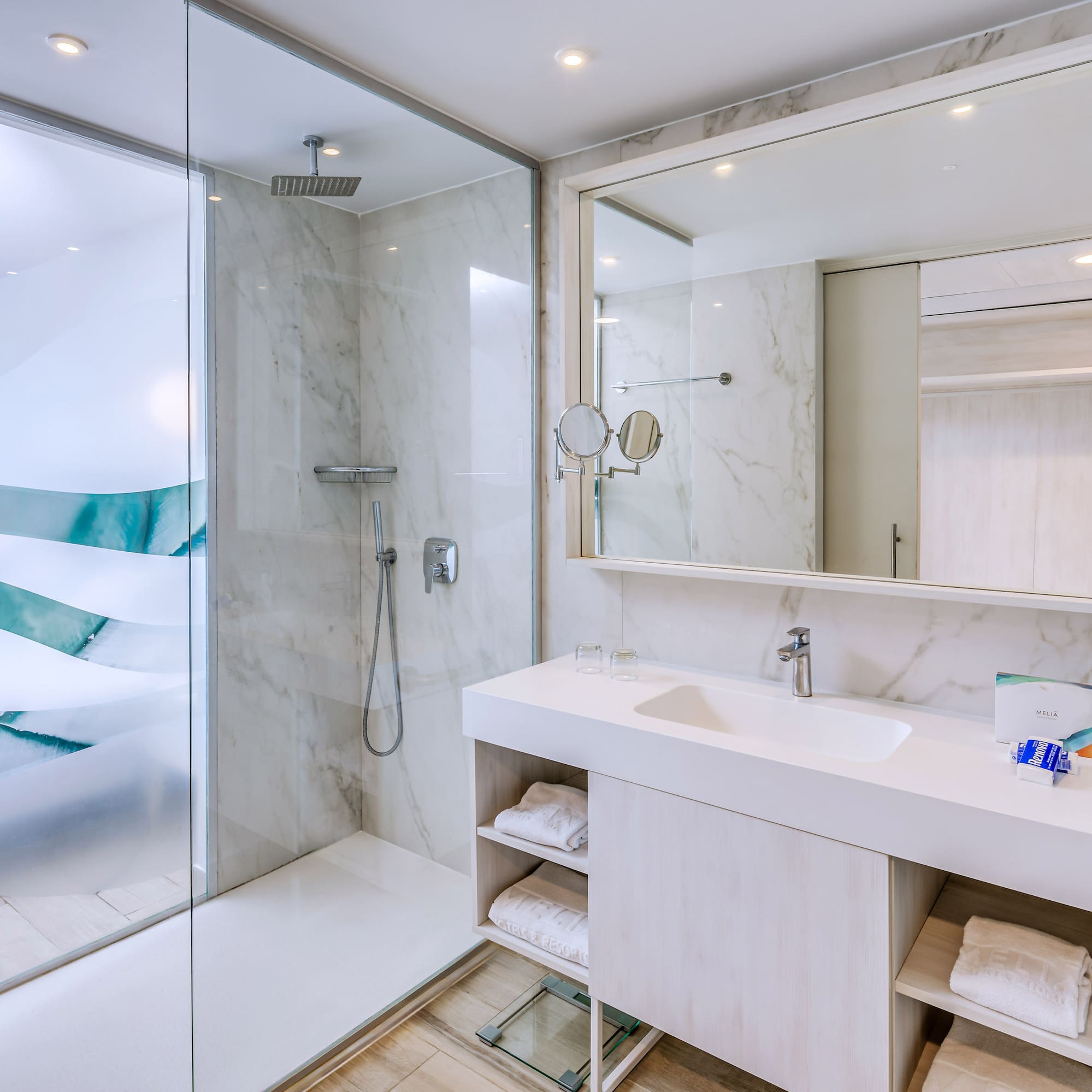 a bathroom with a shower and sink