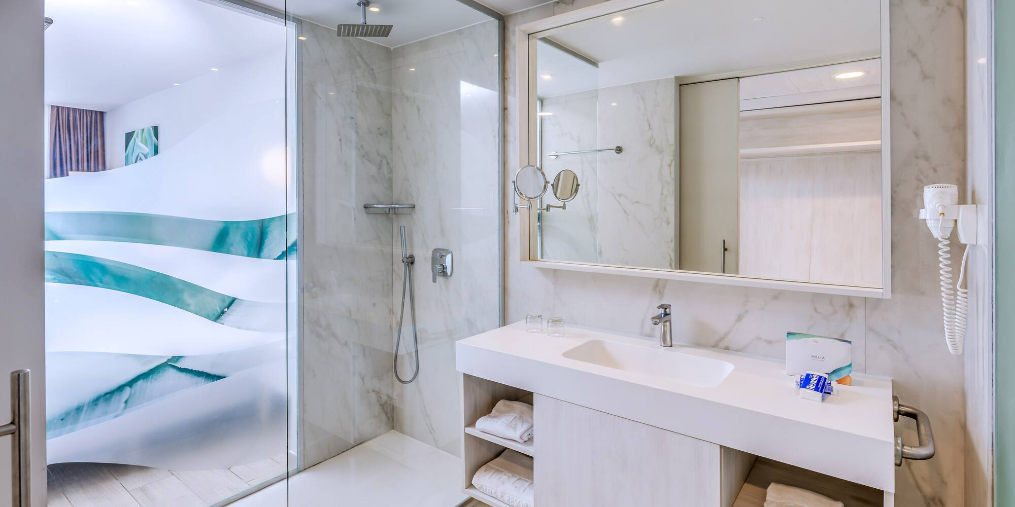 a bathroom with a shower and sink