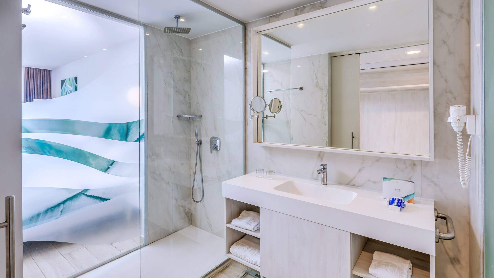 a bathroom with a shower and sink