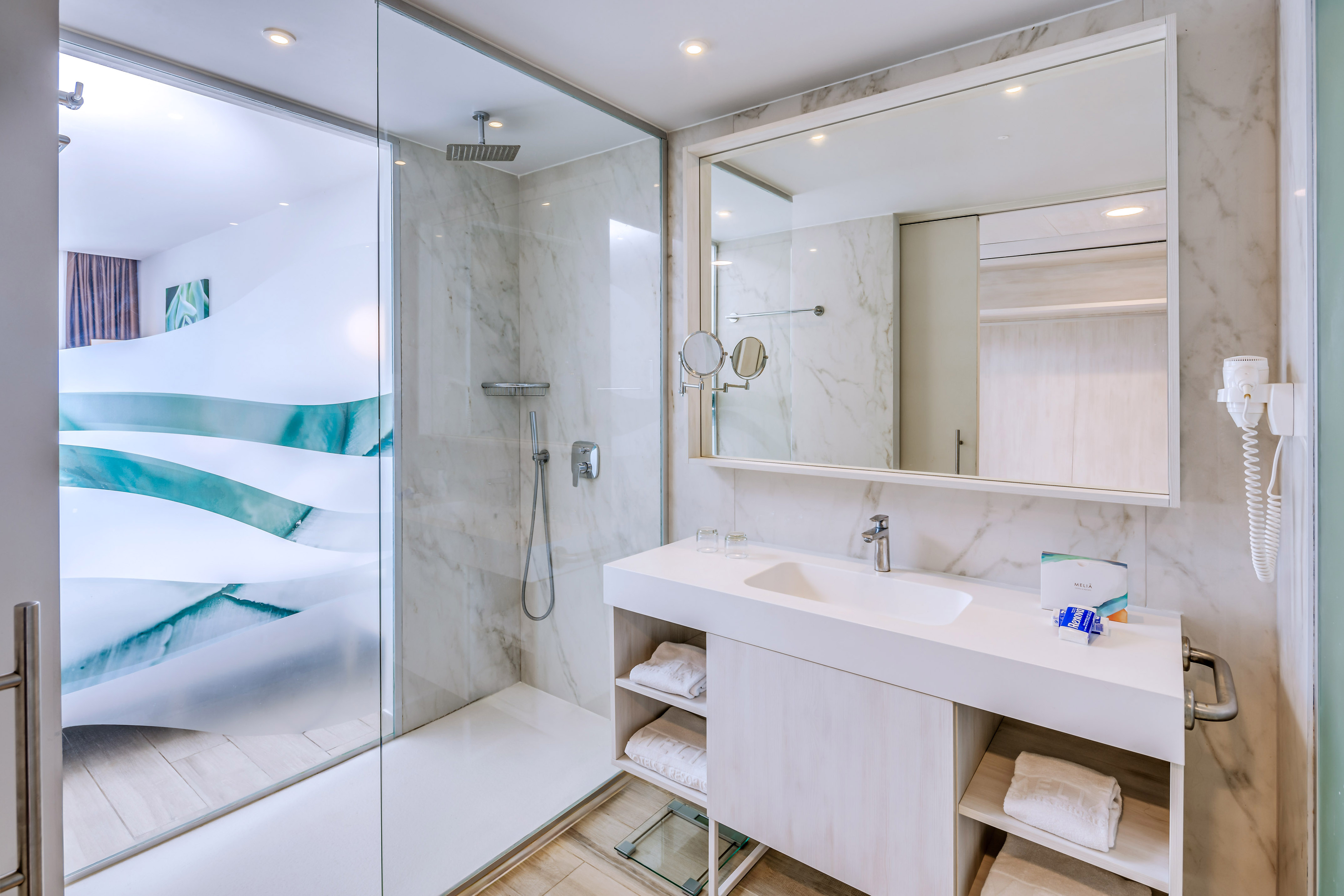 a bathroom with a shower and sink