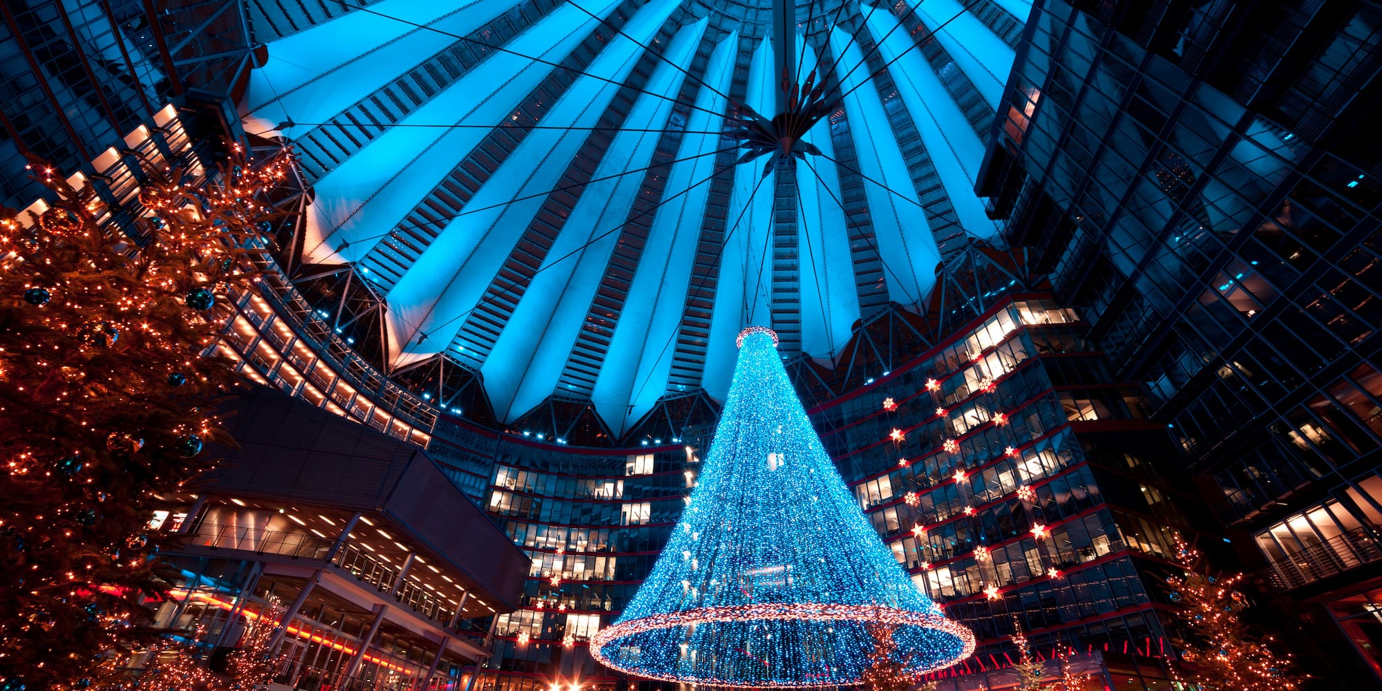 Blue LED Christmas tree in Sony Center atrium, festive holiday decor.