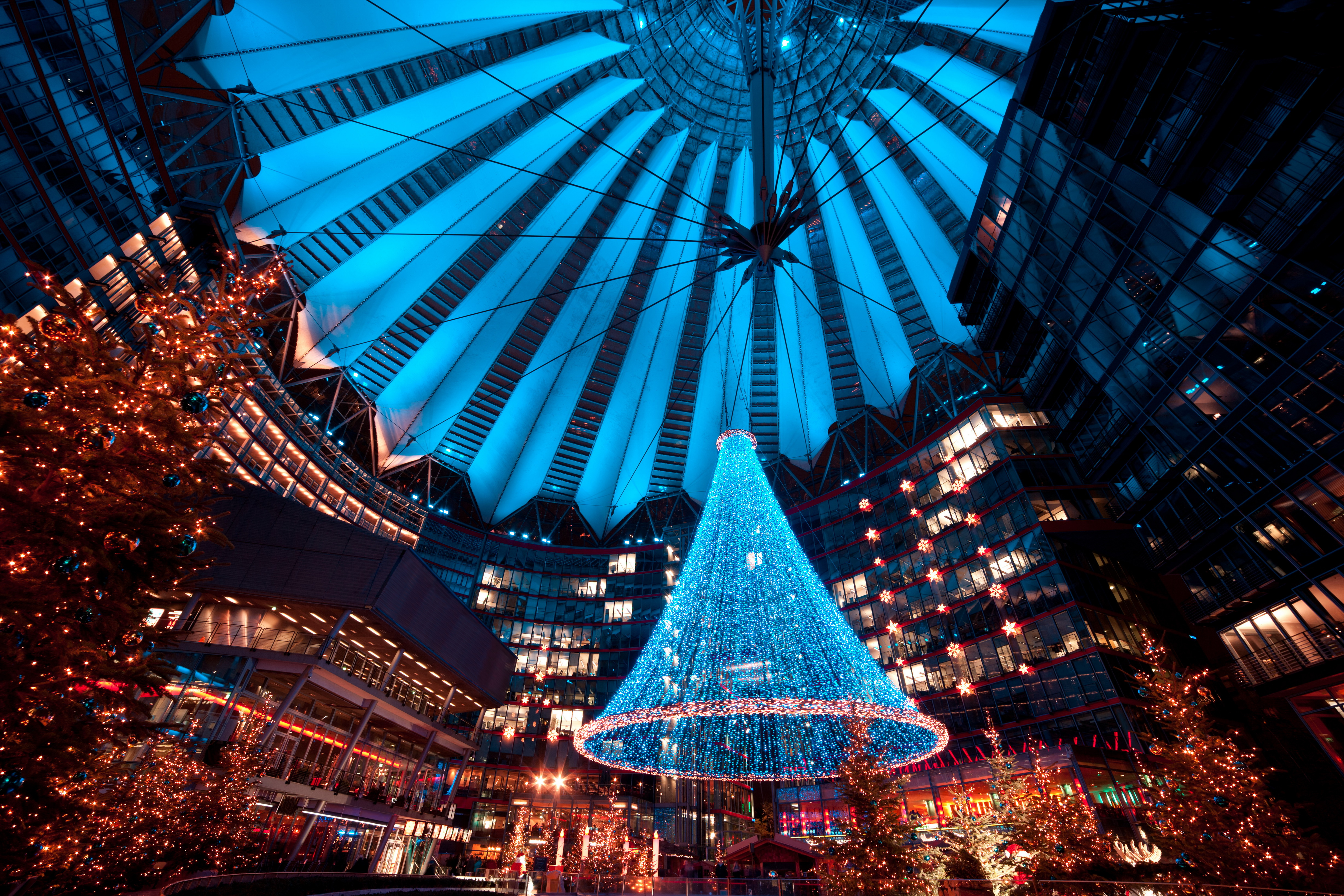 Blue LED Christmas tree in Sony Center atrium, festive holiday decor.