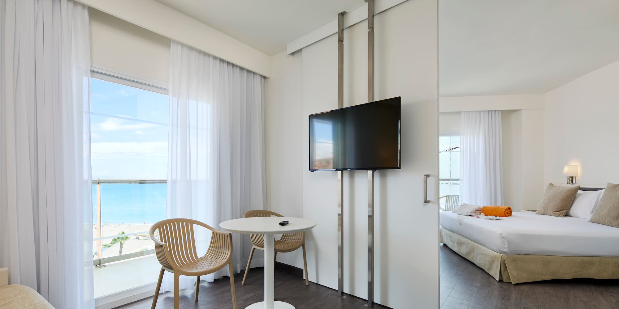 a room with a television and a bed