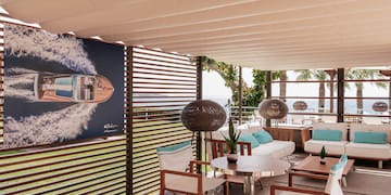 a patio with a poster on the wall