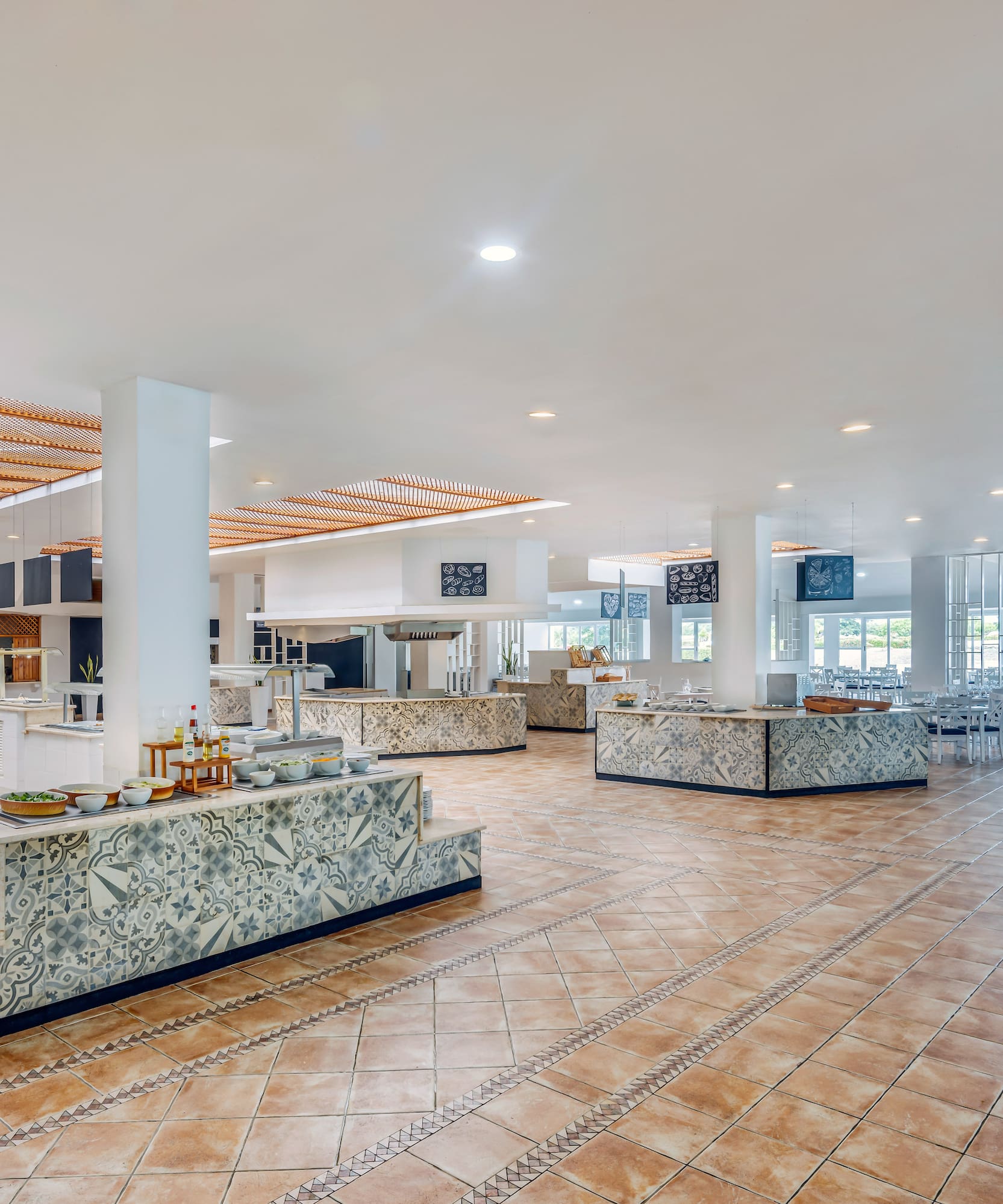 a large room with a large counter and a large ceiling