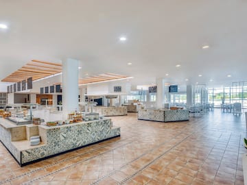 a large room with a large counter and a large ceiling